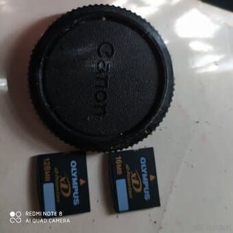 Popruh Nikon D750, různé krytky Canon, Olympus