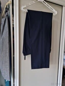 Nové tm. modré eleg. kalhoty, vel 38