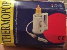 Ohřívač láhví thermopop s vyměnitelnou zásuvkou