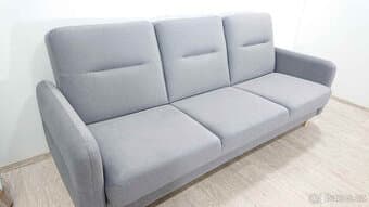 Šedá rozkládací pohovka s úložným prostorem Rhonda